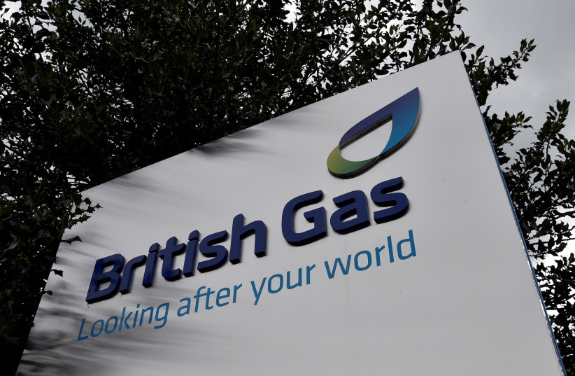  A British Gas sign is seen outside its offices in Staines in southern England, July 31, 2014 (credit: TOBY MELVILLE/REUTERS)