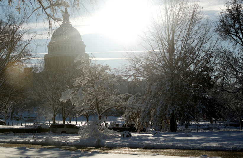  THE US Capitol building is blanketed with snow, in Washington, January 4. (photo credit: TOM BRENNER/REUTERS)