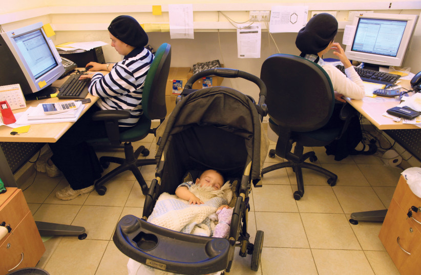  HAREDI WOMEN tap away at their computers at a hi-tech company in Beitar Illit. (credit: NATI SHOHAT/FLASH90)