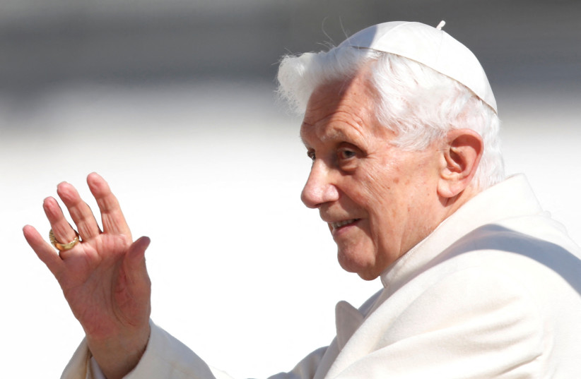 Pope Benedict XVI waves to the faithful as he arrives in St Peter's Square to hold his last general audience at the Vatican, February 27, 2013. (credit: REUTERS/ALESSANDRO BIANCHI/FILE PHOTO)