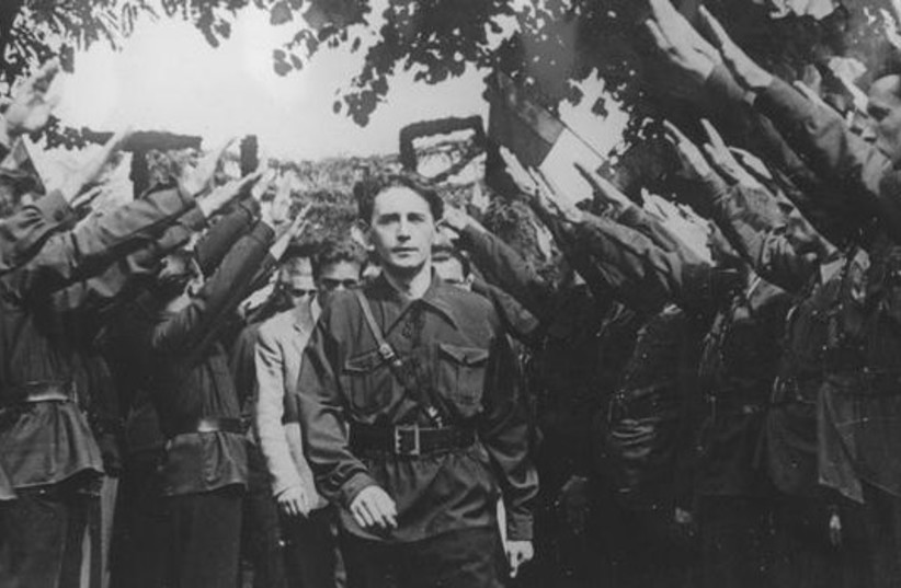  Horia Sima is seen with Iron Guard Legionnaires in Bucharest, Romania, in September 1940. (credit: Wikimedia Commons)