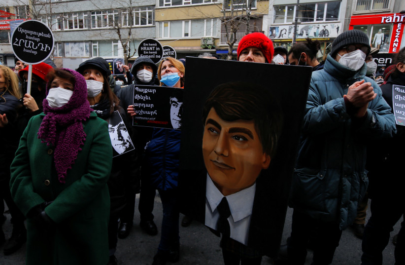  People gather at the spot where Turkish-Armenian journalist Hrant Dink was killed, to mark the 15th anniversary of his death, in Istanbul, Turkey January 19, 2022. (credit: DILARA SENKAYA/REUTERS)
