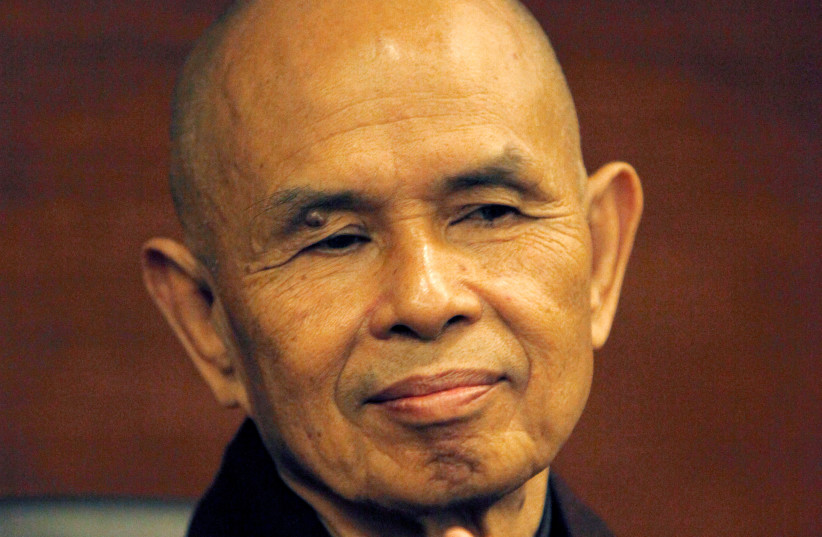  French-based Buddhist zen master Thich Nhat Hanh gestures during his arrival at Suvarnabhumi airport in Bangkok. (credit: REUTERS)