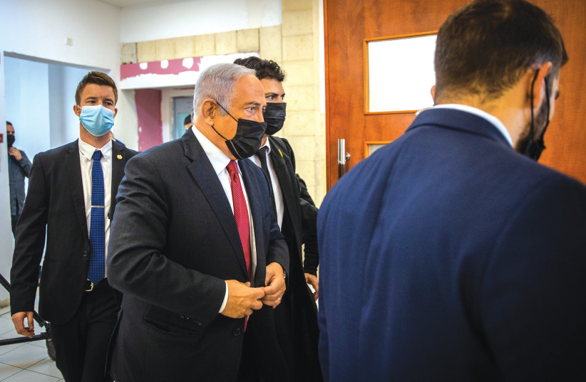  OPPOSITION LEADER MK Benjamin Netanyahu arrives for a hearing in his ongoing trial at Jerusalem District Court in November. (photo credit: OREN BEN HAKOON/FLASH90)