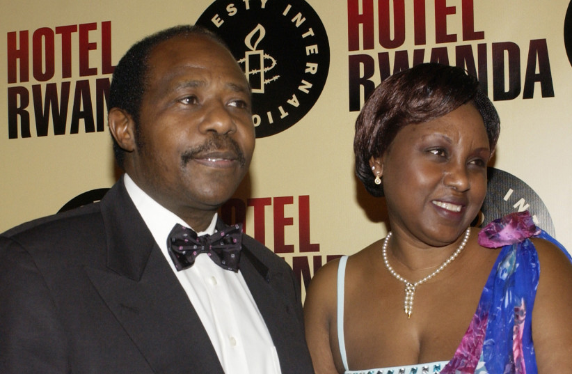  Paul Rusesabagina, the inspiration for the motion picture drama ''Hotel Rwanda,'' arrives with his wife, Tatiana, for the premiere of the film at the Academy of Motion Picture Arts and Sciences in Beverly Hills, California December 2, 2004 (credit: JIM RUYMEN/REUTERS)