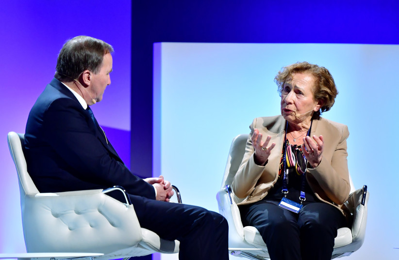  Sweden's Prime Minister Stefan Lofven speaks with Holocaust survivor Dina Rajs during the Malmo International Forum on Holocaust Remembrance and Combating Antisemitism in Malmo, Sweden, October 13, 2021. (photo credit: Jonas Ekstromer/TT News Agency/via REUTERS)