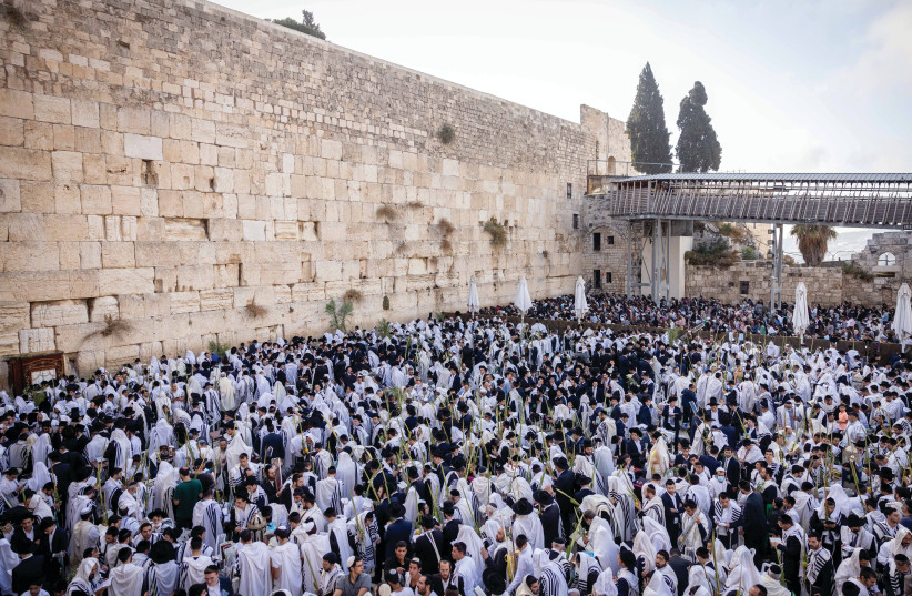  THE MASSES pray at the Western Wall during Sukkot. (photo credit: YONATAN SINDEL/FLASH90)