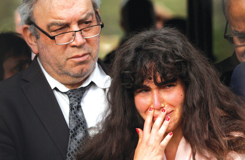  HOWARD KAYE holds his daughter Hannah Jacqueline Kaye at the funeral for Lori Gilbert-Kaye, killed in the shooting at a Chabad synagogue in Poway, California, in 2019 (photo credit: JOHN GASTALDO/REUTERS)