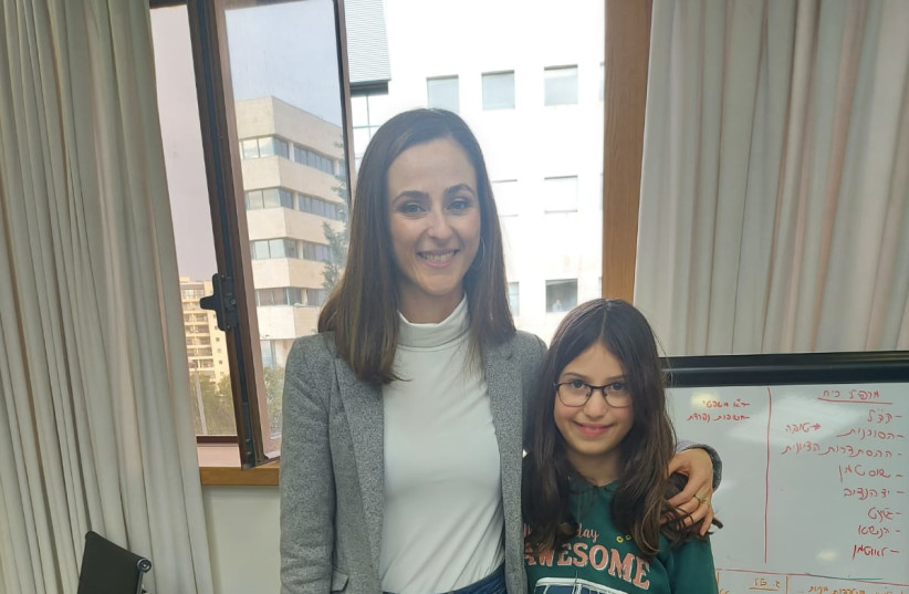  Minister of Social Equality and Pensioners Meirav Cohen poses for a photograph with nine-year-old Meirav, the writer's granddaughter (photo credit: Shoshana Tita)