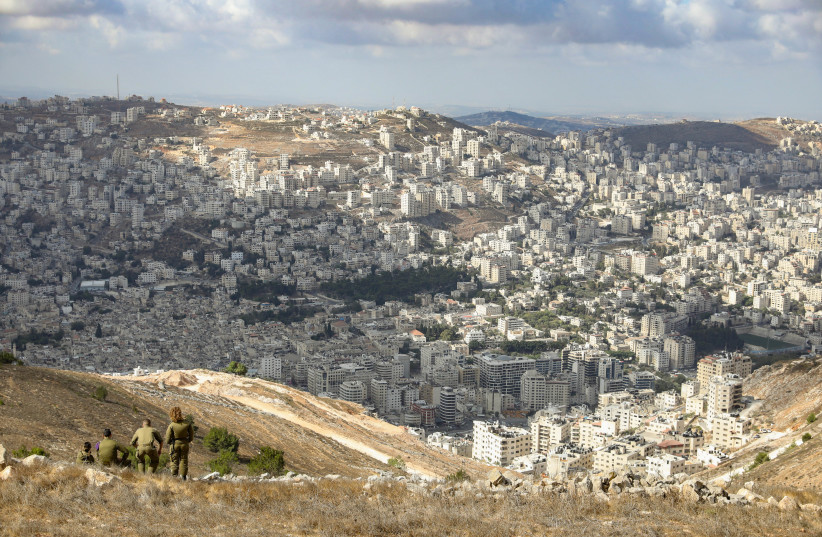  IDF soldiers survey Nablus from Mount Ebal (credit: MARC ISRAEL SELLEM)