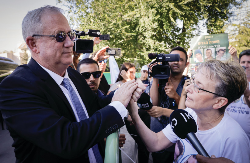  DEFENSE MINISTER Benny Gantz greets Leah Goldin, mother of fallen soldier Hadar Goldin, outside the annual state memorial ceremony on Mount Herzl in Jerusalem in June, marking the anniversary of the 2014 Operation Protective Edge.  (photo credit: OLIVIER FITOUSSI/FLASH90)