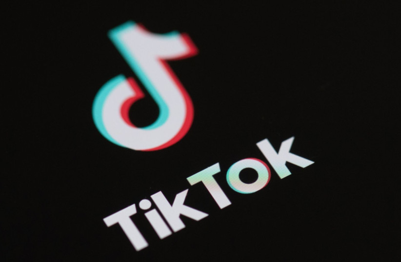  Logo of the social network application Tik Tok on the screen of a phone. (photo credit: MARTIN BUREAU/AFP VIA GETTY IMAGES)