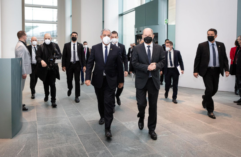 Knesset Speaker Mickey Levy walks with new German chancellor Olaf Scholz at the German chancellery in Berlin. (credit: BOAZ ARAD)