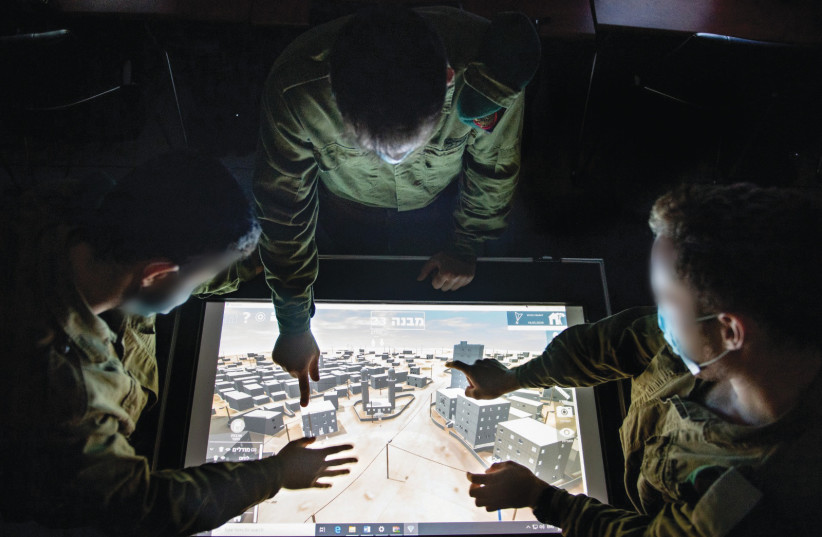  DISCUSSING IMAGES on a 3D map created by Unit 9900.  (photo credit: IDF SPOKESPERSON'S UNIT)