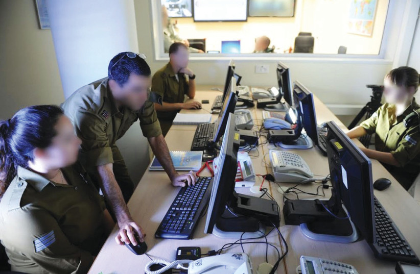  STUDYING IMAGES to map targets for the Israeli military. (credit: IDF SPOKESPERSON'S UNIT)
