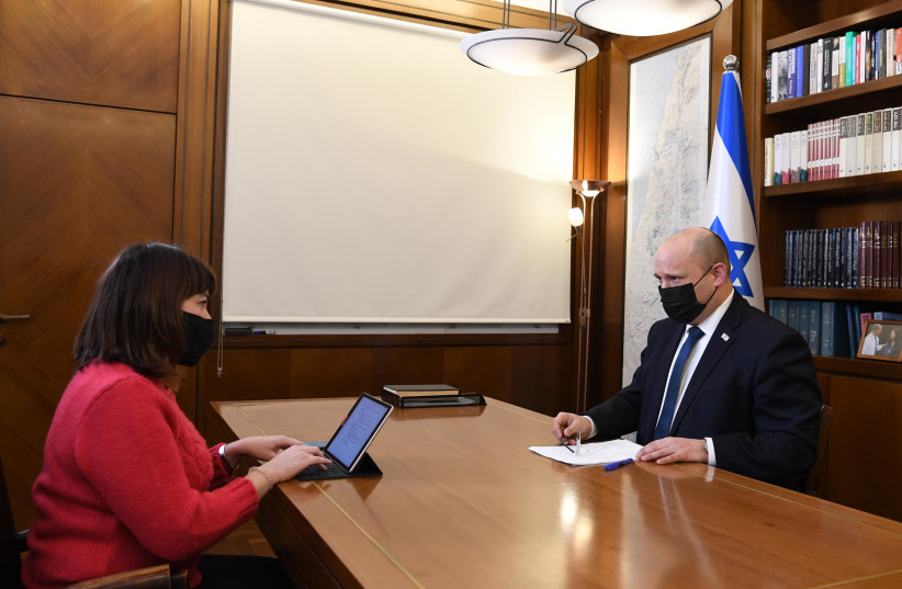 The Jerusalem Post's Lahav Harkov interviews Prime Minister Naftali Bennett in January 2022. (credit: HAIM ZACH/GPO)