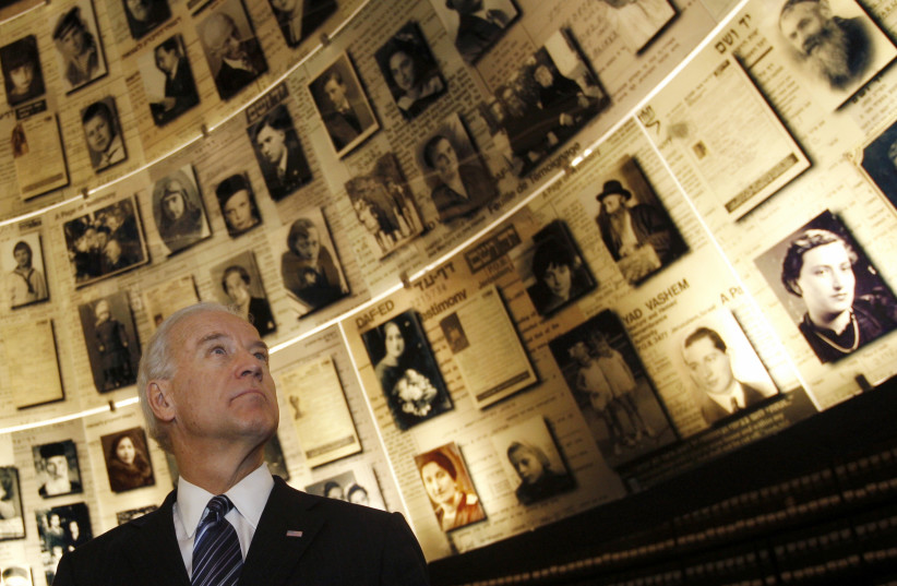 US VP Joe Biden looks at pictures of Jews killed in the Holocaust during a visit to the Hall of Names at the Yad Vashem Holocaust History Museum in Jerusalem March 9, 2010 (credit: RONEN ZVULUN/REUTERS)