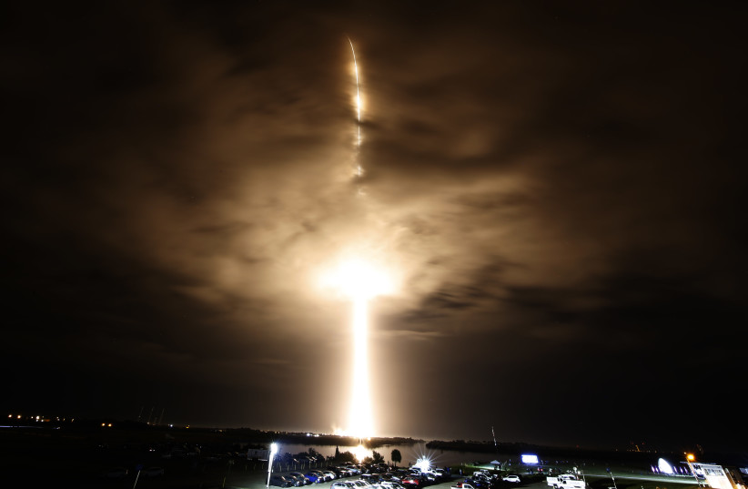  A SpaceX Falcon 9 rocket, with the Crew Dragon capsule, is launched carrying three NASA and one ESA astronauts on a mission to the International Space Station at the Kennedy Space Center in Cape Canaveral, Florida, US, November 10, 2021.  (photo credit: JOE SKIPPER/REUTERS)