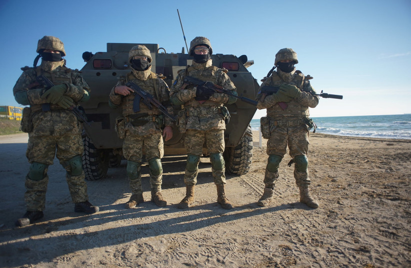  Service members of the 28th Separate Mechanized Brigade of the Ukrainian Armed Forces take part in coastal defence drills in the Odessa region, Ukraine, in this handout picture released January 28, 2022. (credit: Ukrainian Defence Ministry/Handout via REUTERS)