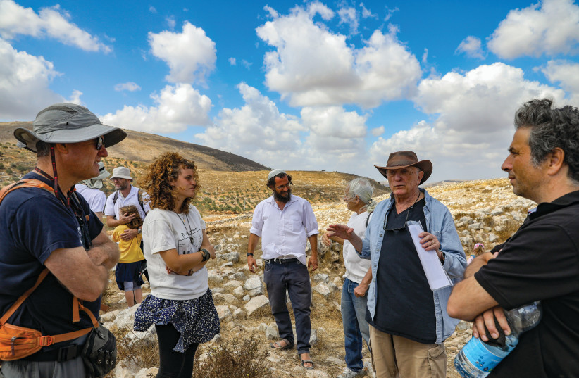  Zvi Koenigsberg teaching visitors about the holy site.  (credit: MARC ISRAEL SELLEM/THE JERUSALEM POST)
