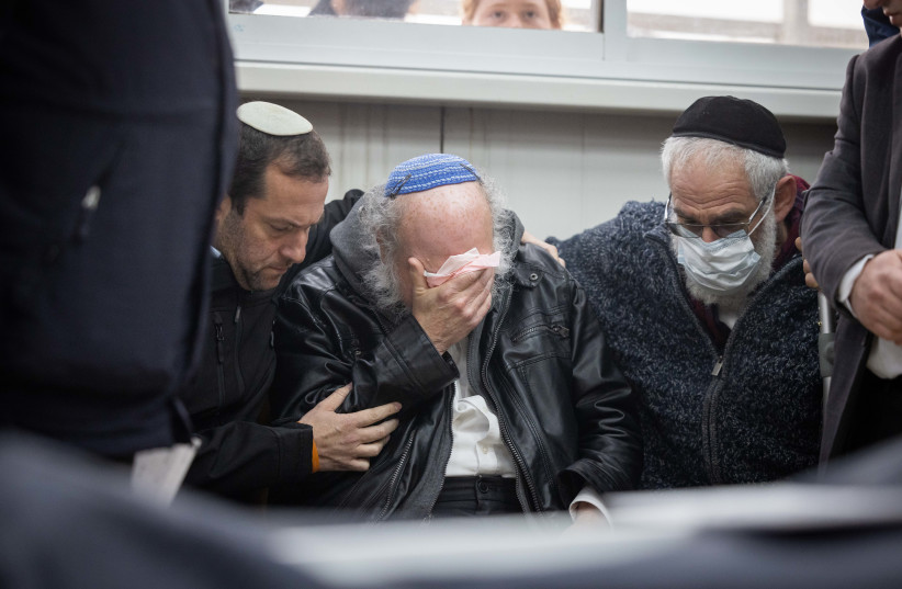  Jonathan Pollard attends the funeral of his wife Esther in Jerusalem. Esther died of COVID complications at the age of 68, January 31, 2022.  (photo credit: YONATAN SINDEL/FLASH90)