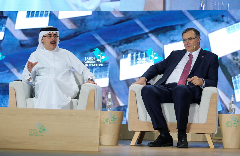  President & CEO of Saudi Aramco, Amin H. Nasser speaks next to Chairman of the Board & CEO of TotalEnergies, Patrick Pouyanne during the Saudi Green Initiative Forum to discuss efforts by the world's top oil exporter to tackle climate change in Riyadh, Saudi Arabia, October 23, 2021. (credit: REUTERS/AHMED YOSRI)