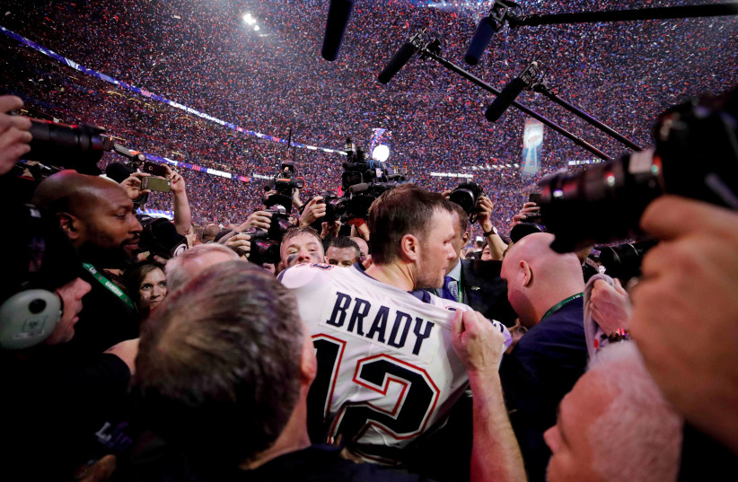  Tom Brady celebrates winning the Super Bowl LIII at Mercedes-Benz Stadium, Atlanta, Georgia, U.S. February 3, 2019. (credit: MIKE SEGAR / REUTERS)