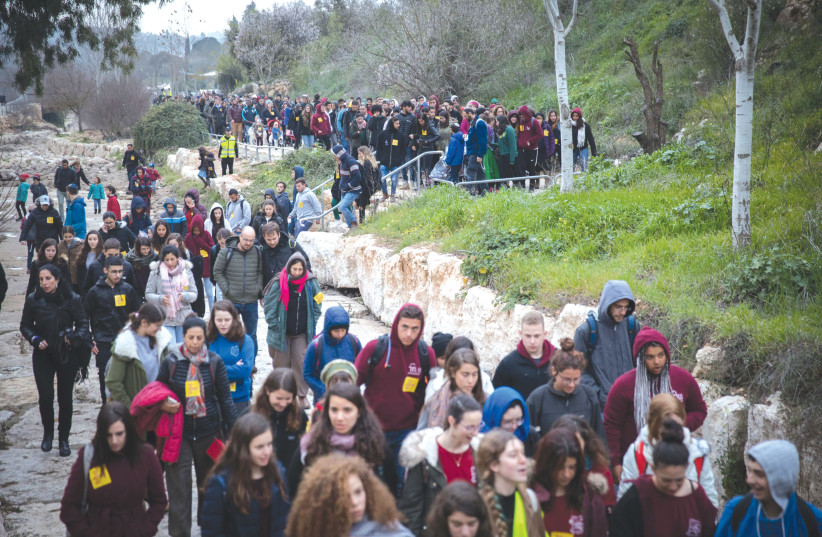  A MEMORIAL march took place at the Ein Yael outdoor museum in February 2019 after Ori Ansbacher was raped and murdered in a nearby forest by a terrorist. (photo credit: NOAM REVKIN FENTON/FLASH90)
