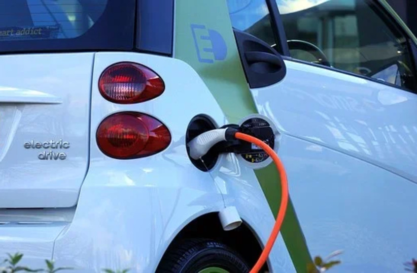  An electric car charging. (credit: PIXABAY)