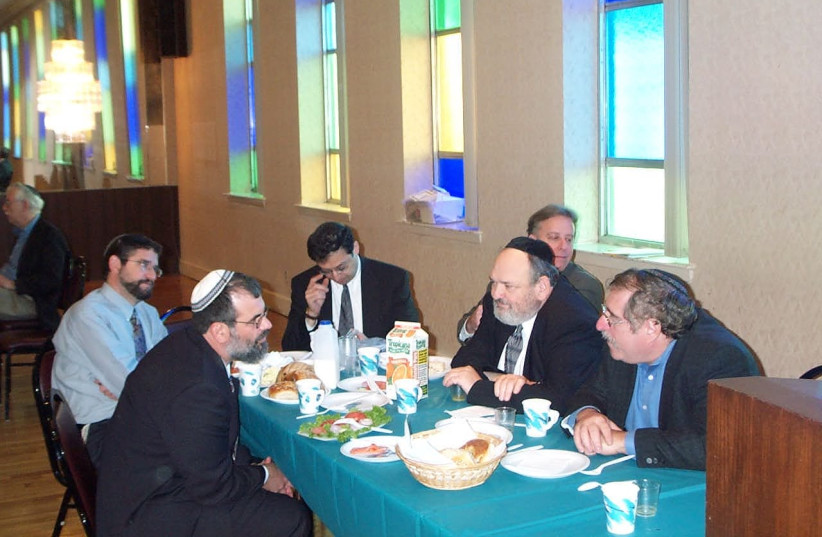  SUNDAY-MORNING breakfast at the shul with (from L, back row) congregants Mark Gross, Andy Lipton and Sandy Cohen. (credit: Mike Gross)