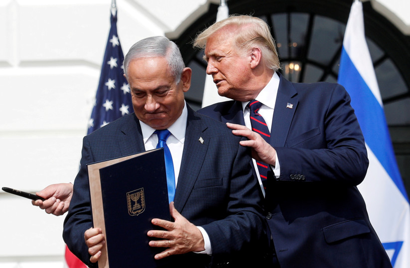  Israel's Prime Minister Benjamin Netanyahu stands with U.S. President Donald Trump after signing the Abraham Accords (credit: REUTERS/TOM BRENNER)