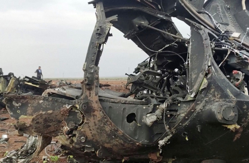  Debris of a destroyed US helicopter involved in the US operation conducted against an Islamic State group leader in the northwestern parts of Syria's Idlib province, is seen in this screen grab taken from a video obtained by REUTERS February 3, 2022. (photo credit: REUTERS TV/via REUTERS)