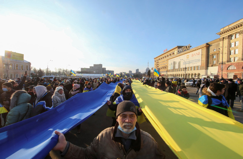  People take part in the Unity March, which is a procession to demonstrate the patriotic spirit of local residents amid growing tensions with Russia, in Kharkiv, Ukraine February 5, 2022. (credit: REUTERS/VYACHESLAV MADIYEVSKYY)