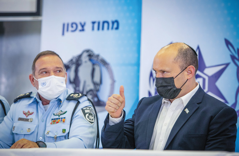 PRIME MINISTER Naftali Bennett with Israel Police chief Insp.-Gen. Kobi Shabtai during a ceremony after the largest-ever police operation against illegal gun dealers, in Tel Aviv in November. (photo credit: YOSSI ALONI/FLASH90)