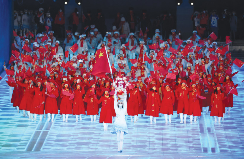  THE CHINA contingent during the athletes’ parade at the opening ceremony of the 2022 Winter Olympic Games in Beijing. (photo credit: PHIL NOBLE/REUTERS)