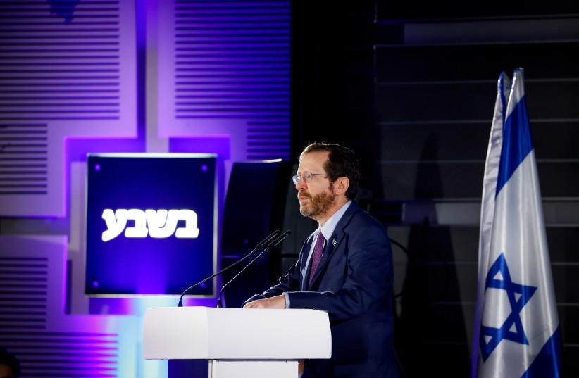  Israeli president Isaac Herzog speaks during a Conference of the 'Besheva' group in Jerusalem, on February 7, 2022.  (photo credit: OLIVIER FITOUSSI/FLASH90)