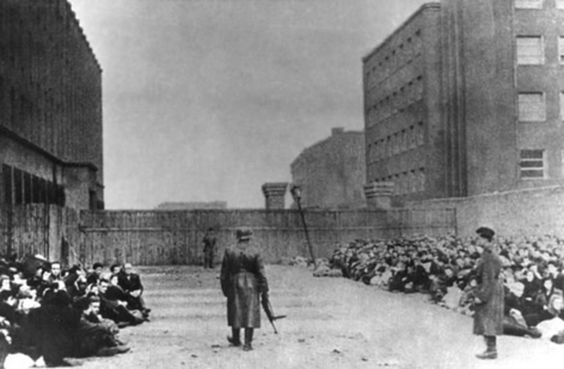  Jews awaiting deportation at the Umschlagplatz in the Warsaw Ghetto. (credit: PUBLIC DOMAIN)