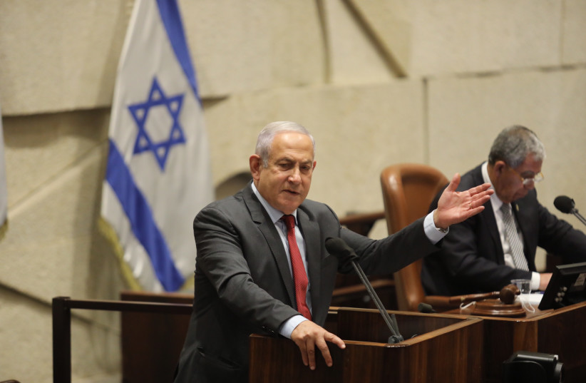  Opposition head Benjamin Netanyahu in the Knesset plenum, February 7, 2022. (photo credit: MARC ISRAEL SELLEM/THE JERUSALEM POST)