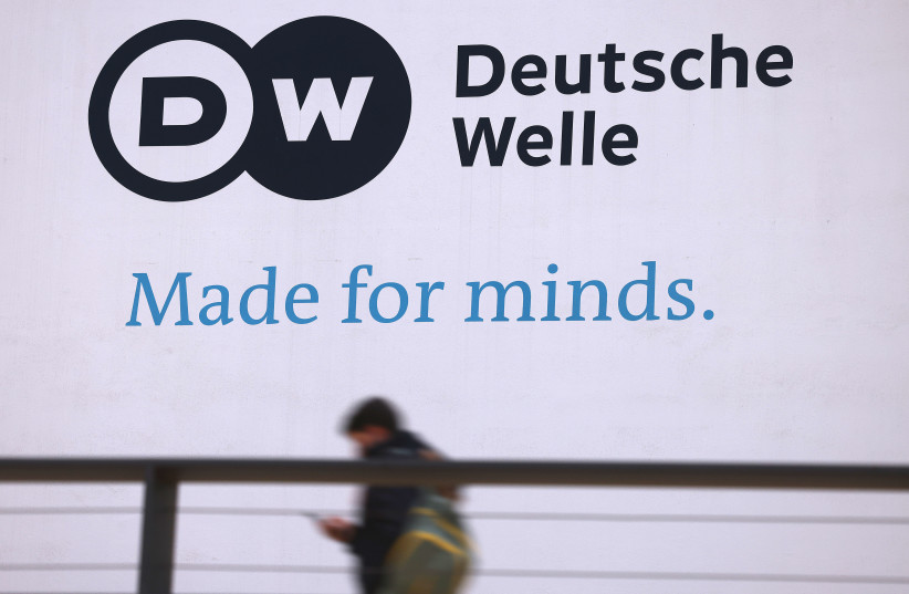  The Deutsche Welle logo is painted on the foreign broadcaster's headquarters in Bonn, Germany.  (credit: Oliver Berg/picture alliance via Getty Images)