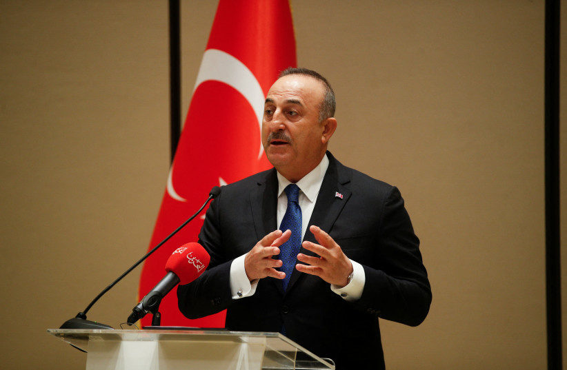  Turkish Foreign Minister Mevlut Cavusoglu speaks during a joint news conference with Bahrain's Foreign Minister Abdullatif Al-Zayani, in Manama, Bahrain, January 31, 2022.  (photo credit: HAMAD I MOHAMMED/REUTERS)