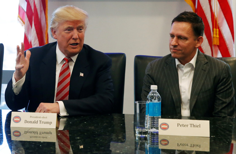  US President-elect Donald Trump sits with PayPal co-founder and Facebook board member Peter Thiel, during a meeting with technology leaders at Trump Tower in New York US., December 14, 2016. (photo credit: SHANNON STAPLETON/ REUTERS)