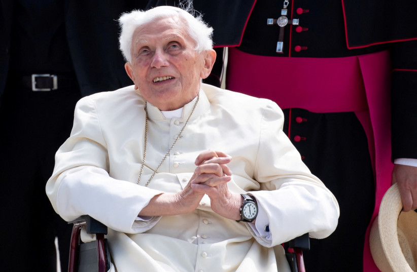  Pope Emeritus Benedict XVI gestures at the Munich Airport before his departure to Rome, June 22, 2020. Former Pope Benedict traveled to his native Germany last week to visit his ailing older brother. (credit: SVEN HOPPE/POOL VIA REUTERS)