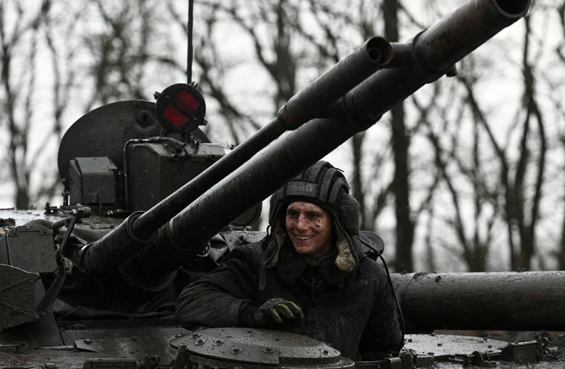  A Russian service member is seen on a BMP-3 infantry fighting vehicle during drills held by the armed forces of the Southern Military District at the Kadamovsky range in the Rostov region, Russia February 3, 2022.  (photo credit: REUTERS/SERGEY PIVOVAROV)
