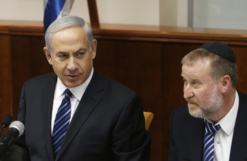  Then-prime minister Benjamin Netanyahu and Avichai Mandelblit at a cabinet meeting in Jerusalem. (photo credit: RONEN ZVULUN/REUTERS)