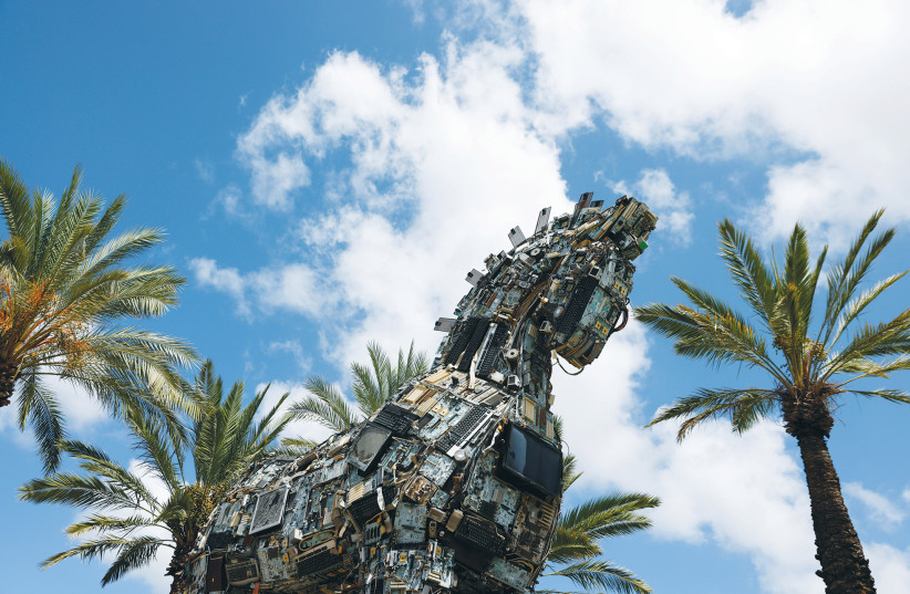  THE HEAD of a ‘Cyber Horse,’ made from discarded electronic bits, is displayed near the entrance to the Cyber Week conference at Tel Aviv University in July 2021. (photo credit: AMIR COHEN/REUTERS)
