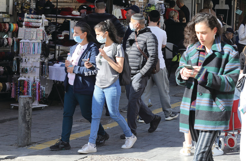 Israelis stroll through downtown Jerusalem this week. (photo credit: MARC ISRAEL SELLEM/JERUSALEM POST ARCHIVES)