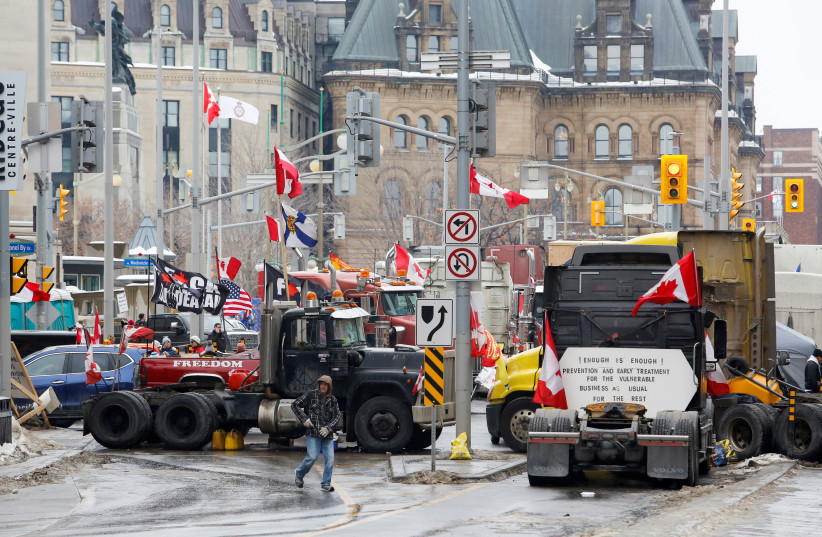  Trucks block downtown streets as truckers and their supporters continue to protest against the coronavirus disease (COVID-19) vaccine mandates, in Ottawa, Ontario, Canada, February 10, 2022. (credit: REUTERS/PATRICK DOYLE)