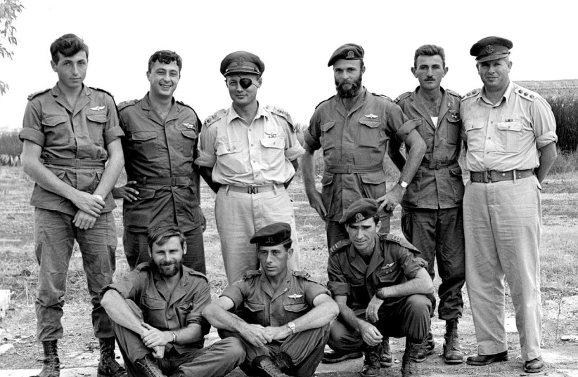 Standing left to right: Meir Har-Zion, Ariel Sharon, Moshe Dayan, Dani Matt, Moshe Efron, Col. Asaf Simchoni. On ground left to right: Aharon Davidi, Ya'akov Ya'akov, 'Raful' Eitan. (photo credit: Wikimedia Commons)