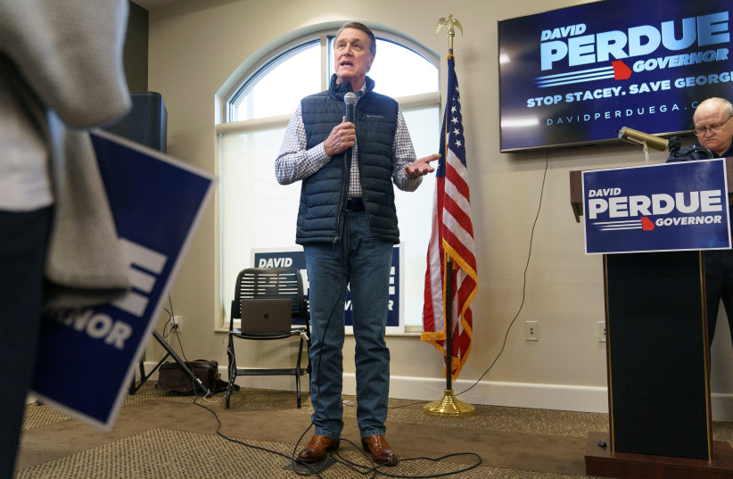 Former Republican US Senator David Perdue, who is primarying incumbent Brian Kemp for Georgia governor, speaks at a campaign event in Covington, Georgia, US, February 2, 2022. (photo credit: REUTERS/ELIJAH NOUVELAGE)