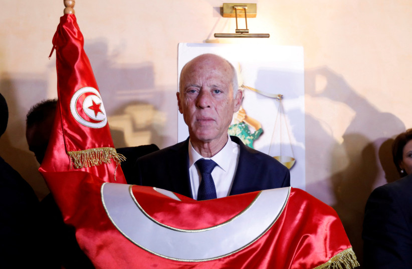 Tunisian presidential candidate Kais Saied reacts after exit poll results were announced in a second round runoff of the presidential election in Tunis, Tunisia October 13, 2019. (photo credit: ZOUBEIR SOUISSI / REUTERS)